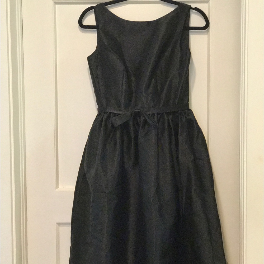 Black sleeveless dress.