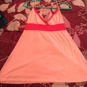 Pink flowing tank top.