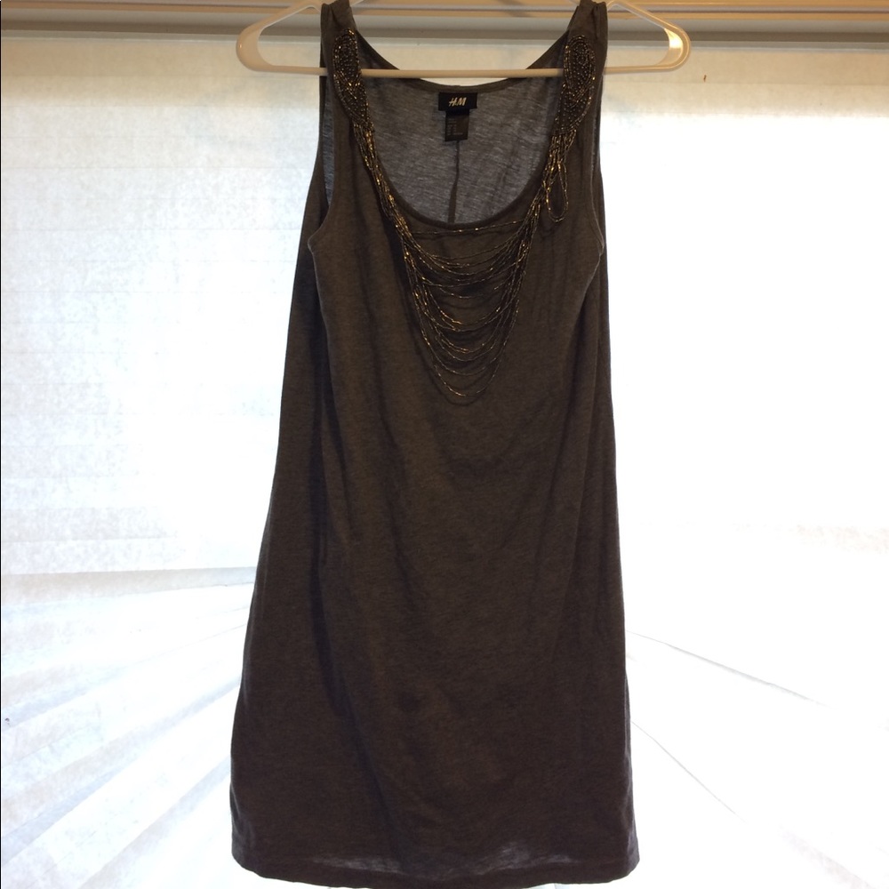 Form fitting dress with beaded neckline