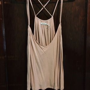 UO light pink criss cross back flowy tank