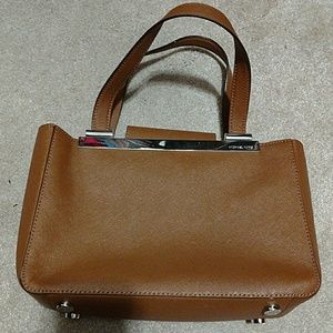 Authentic micheal kors tan leather purse.