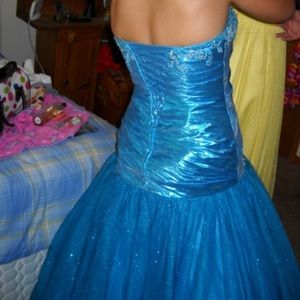 This is a floor length, strapless prom dress.