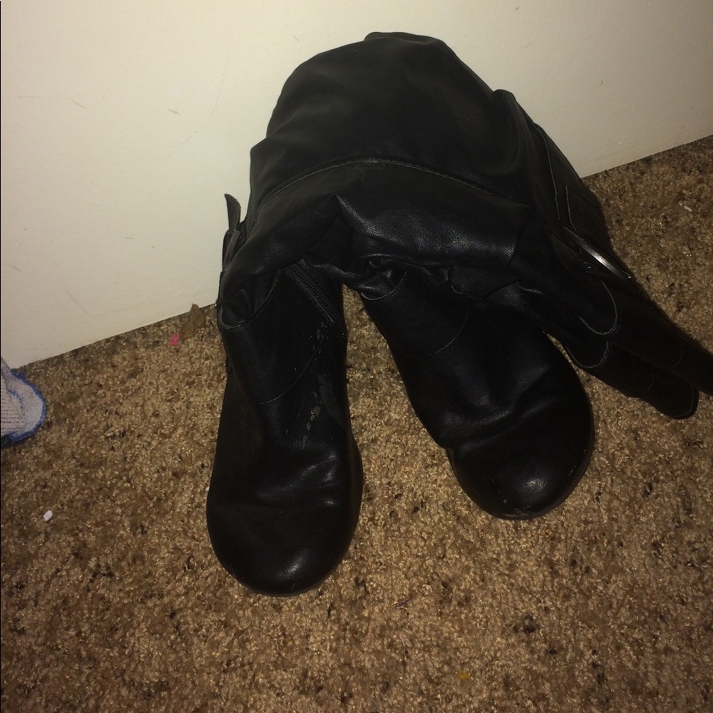 Black heeled zip up boots
