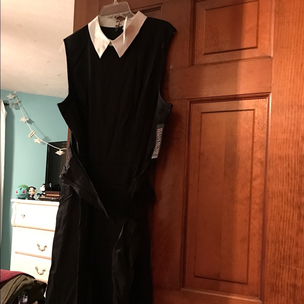 long black jump suit with white trim