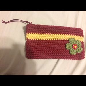 Crocheted zipper wallet with flower