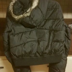 Black youth coat with fur outlining hood