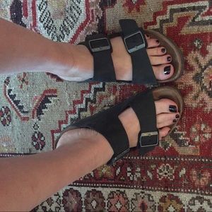 Black leather birkenstocks lightly worn