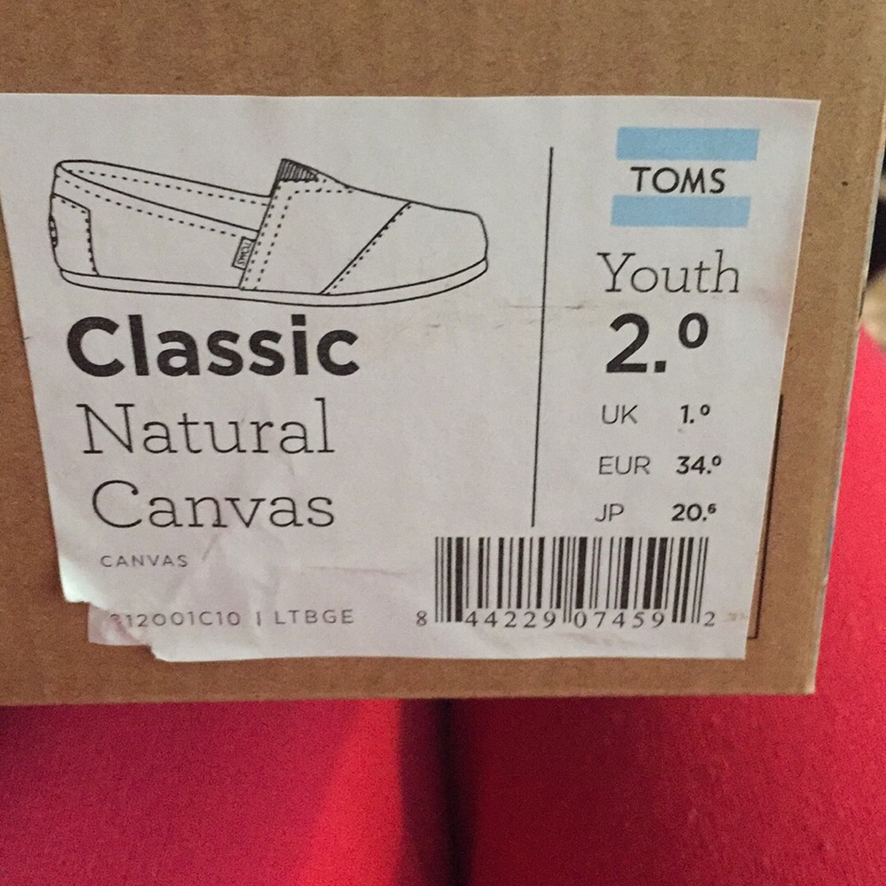 Natural authentic youth Toms size 2.