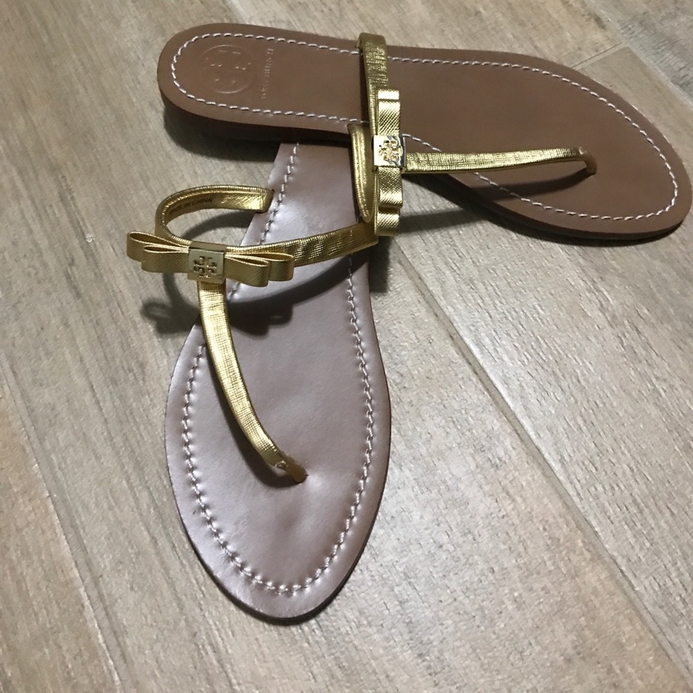 Tory Burch gold sandals.