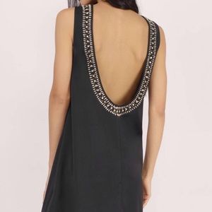 Open back cocktail dress with gemstone detail
