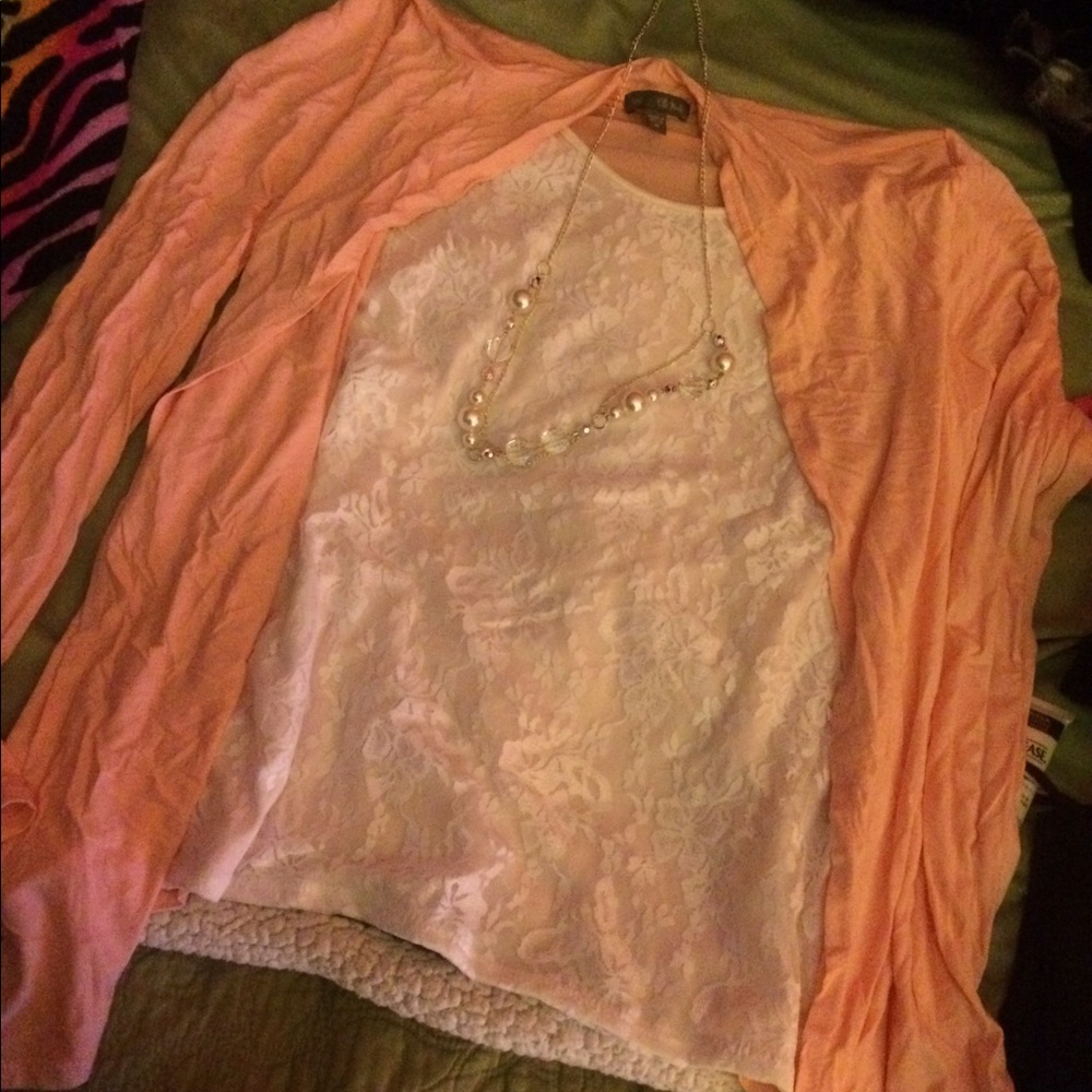 Pink and white long sleeve blouse with necklace