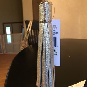 MK SILVER TASSLE FOB/KEY CHARM.