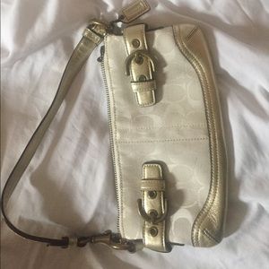 Coach clutch with strap