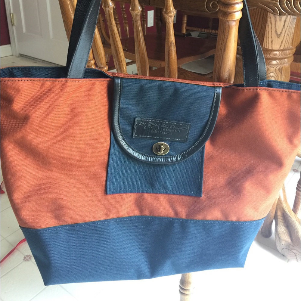 Wayfarer Bag with clasp and leather accents.