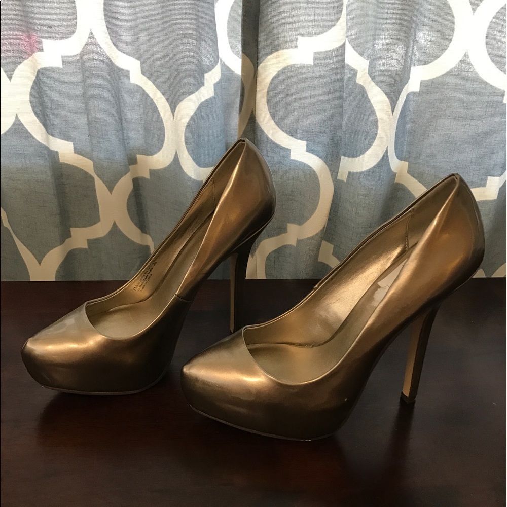 Gold Fergie heels. Slightly used. True to size.