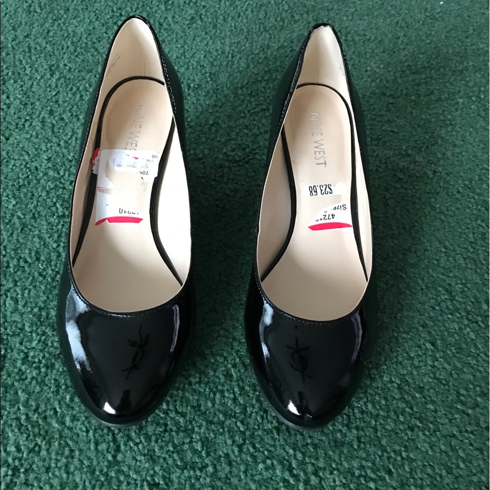 Nine West black patent leather wedges.