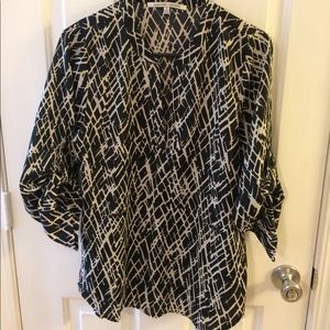 Black and cream/tan blouse