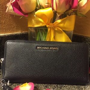 On hold pending sale.  Michael Kors leather wallet