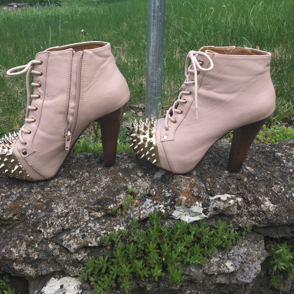 Flesh toned lace up booties with spikes. Chunky