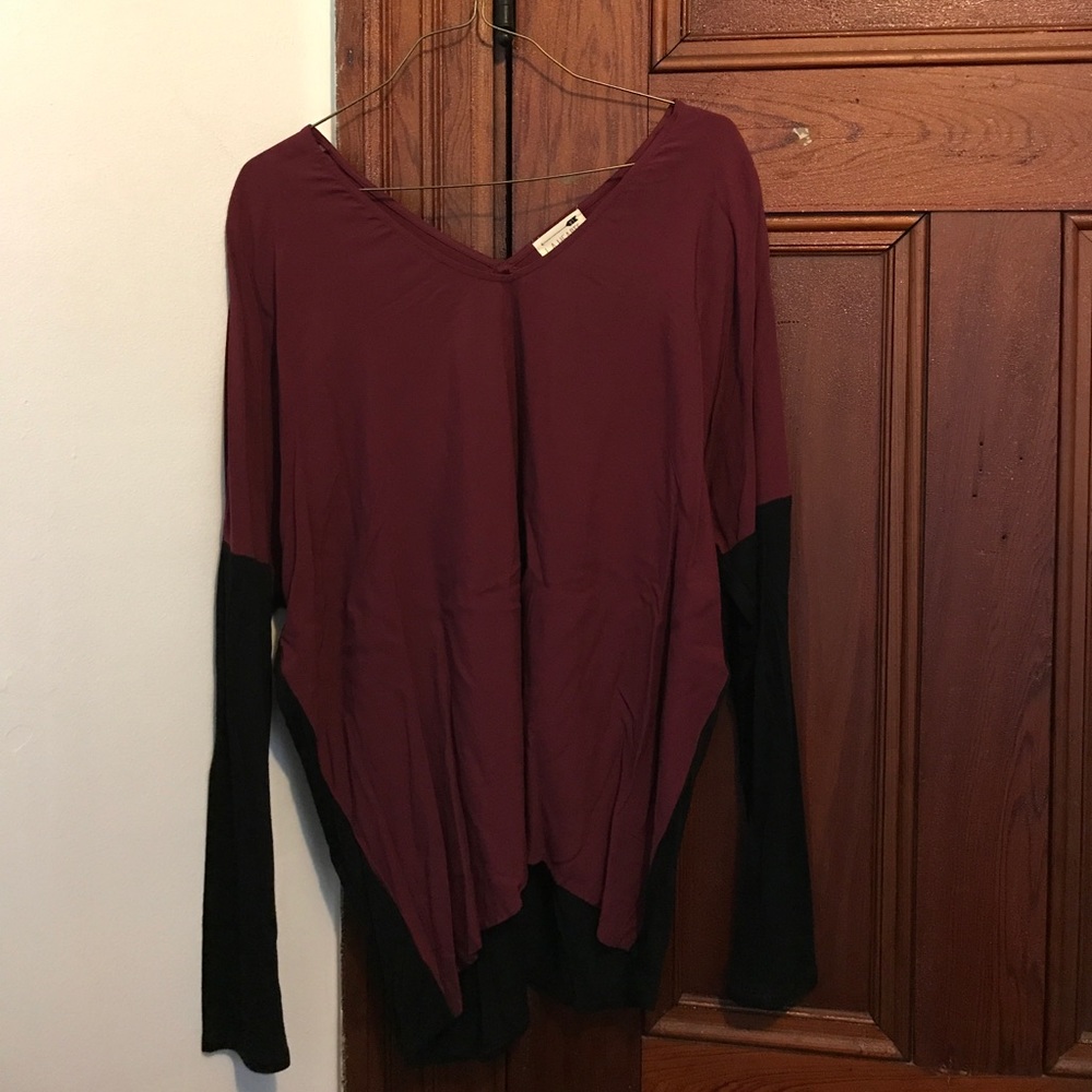 Black and maroon long sleeved shirt. Never worn