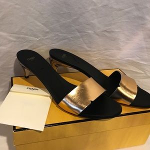 FENDI LOW HEEL SLIP ONS BLACK AND GOLD SANDALS