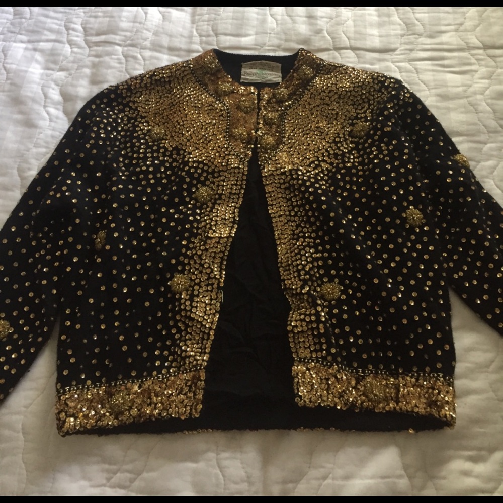 A vintage black jacket with gold sequins