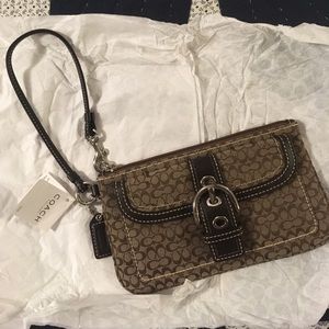 Coach mini-signature wrist bag.