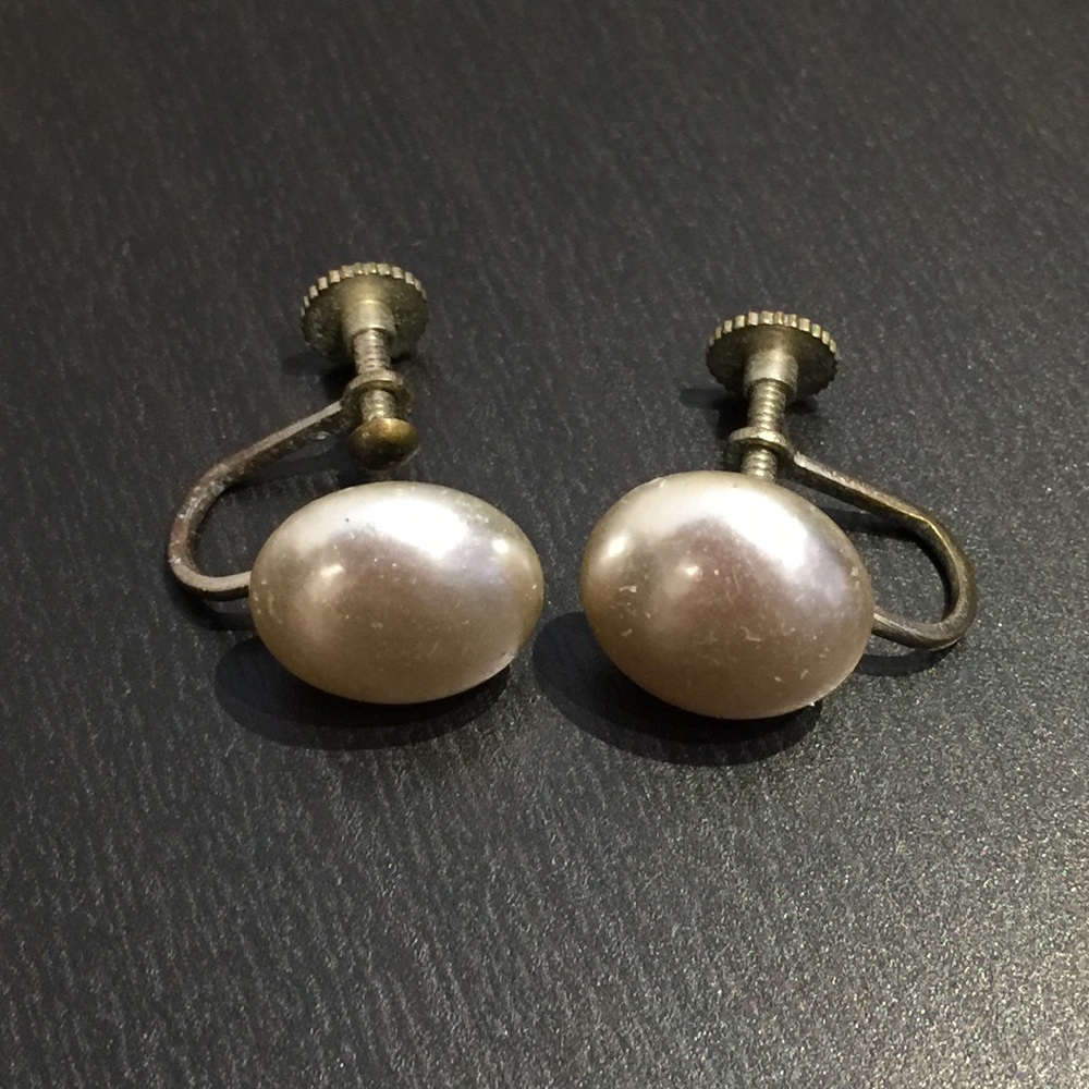 Button faux pearl earrings.