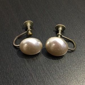 Button faux pearl earrings.