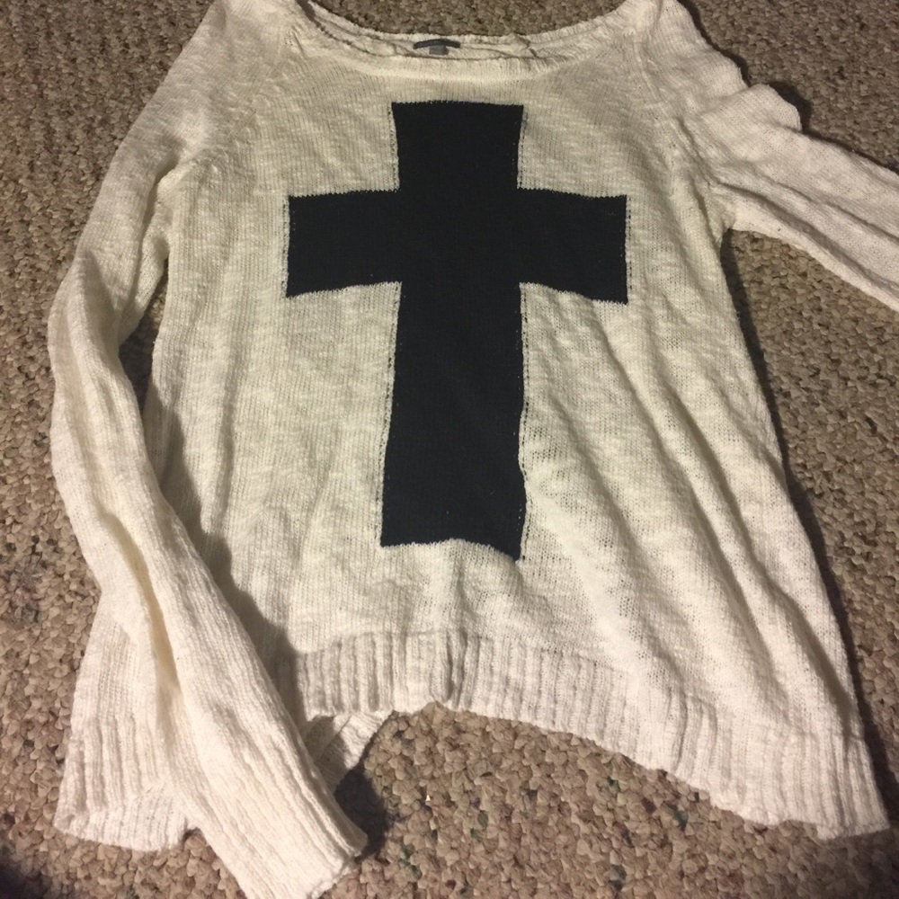 White sweater with cross on front