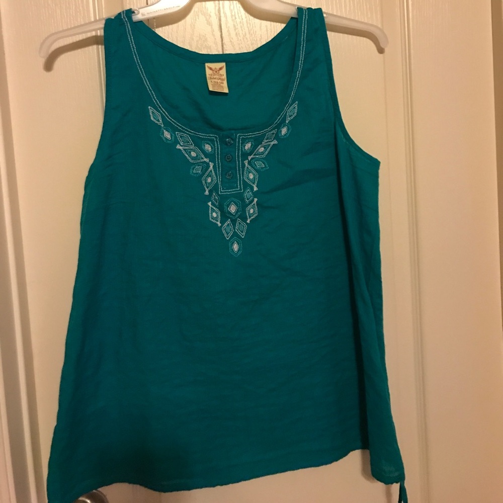 Turquoise blouse with white stitching