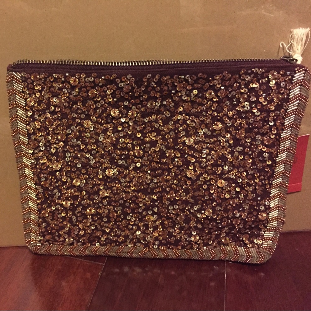 Maroon sequined make-up/clutch bag