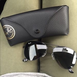 All black RayBan Aviators