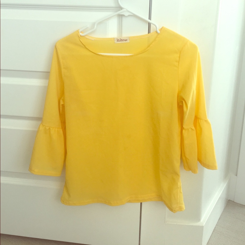 Yellow blouse with ruffle sleeves