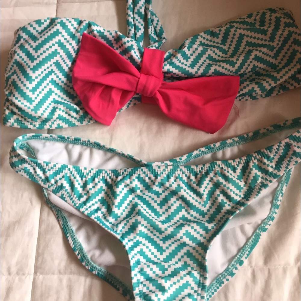 Swim Suit Green white print with pink bow.