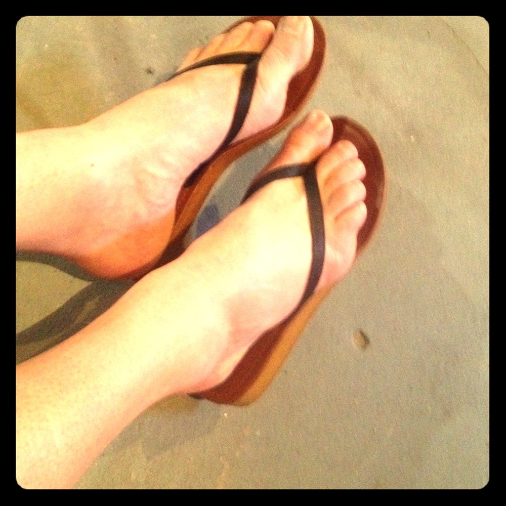 Pre-loved flip flops with small platform heel.