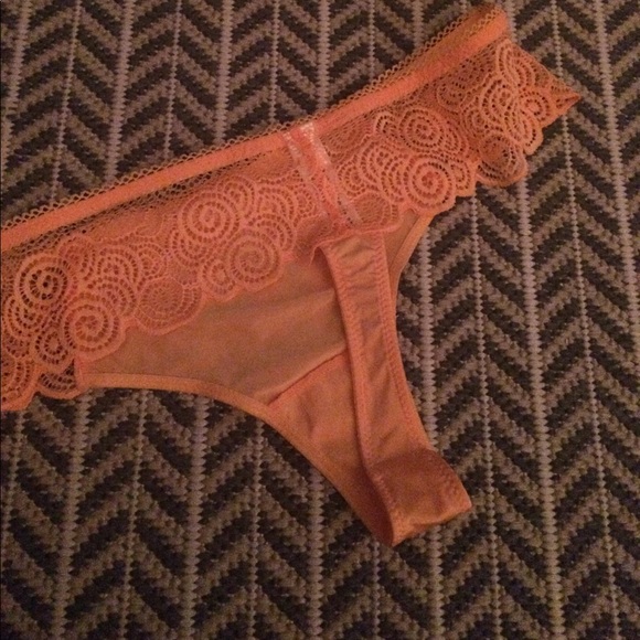 Fun, lacy orange dreamsicle color thong. - Picture 3 of 3