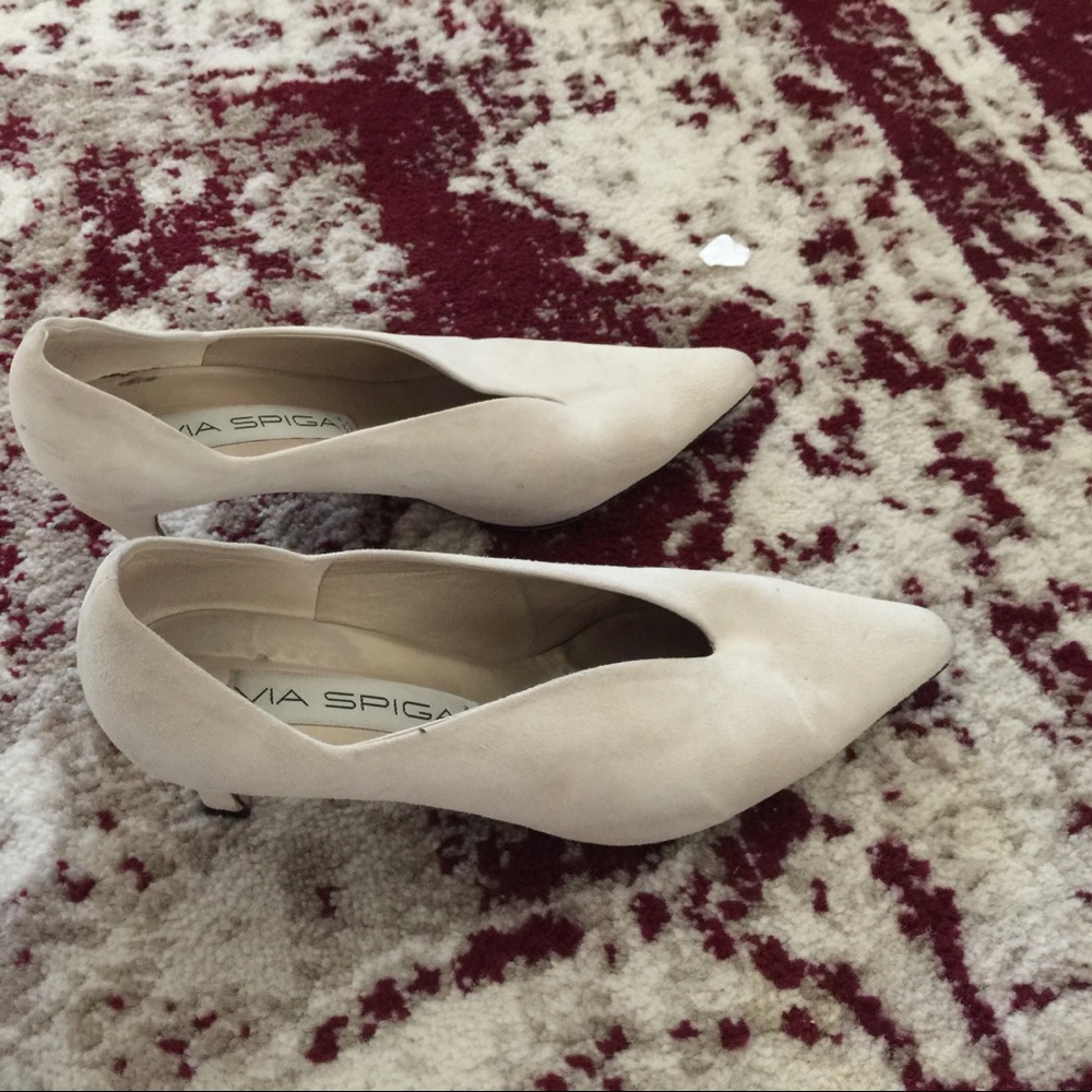 Cream shoes with some wear on the sides