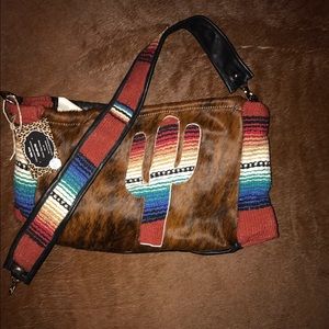 Cowhide cactus serape purse