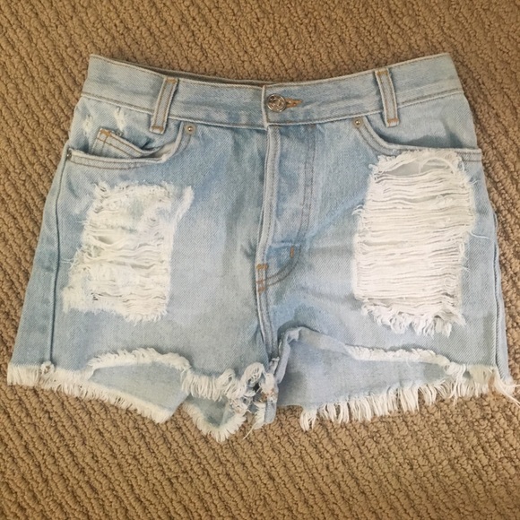light wash ripped shorts