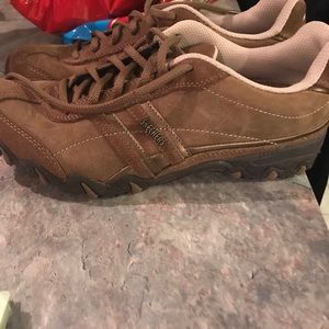 Brown pair of Skechers shoes