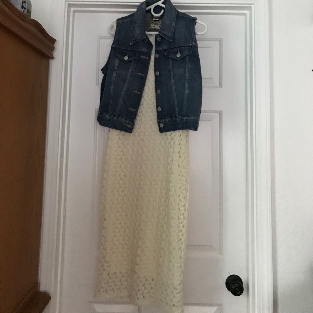 Lace dress with jean vest.