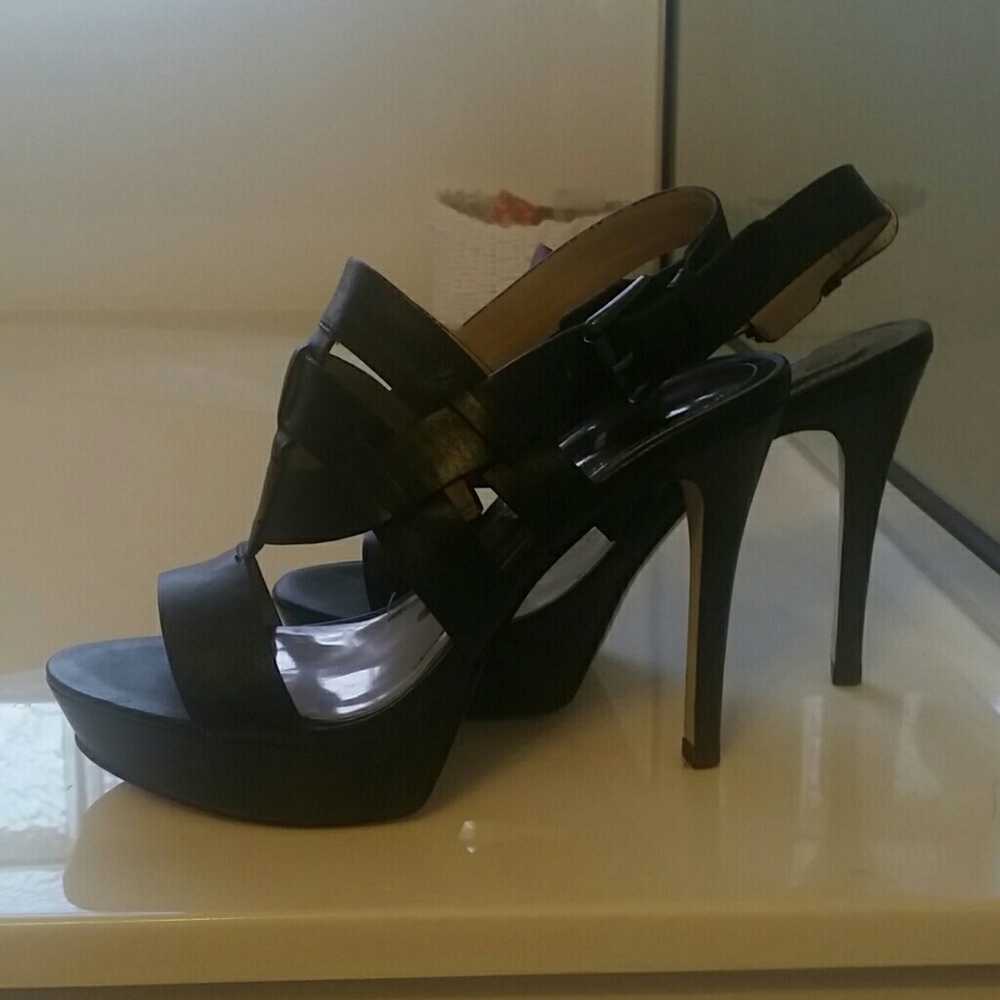 Black platform heel. Upper part is leather.