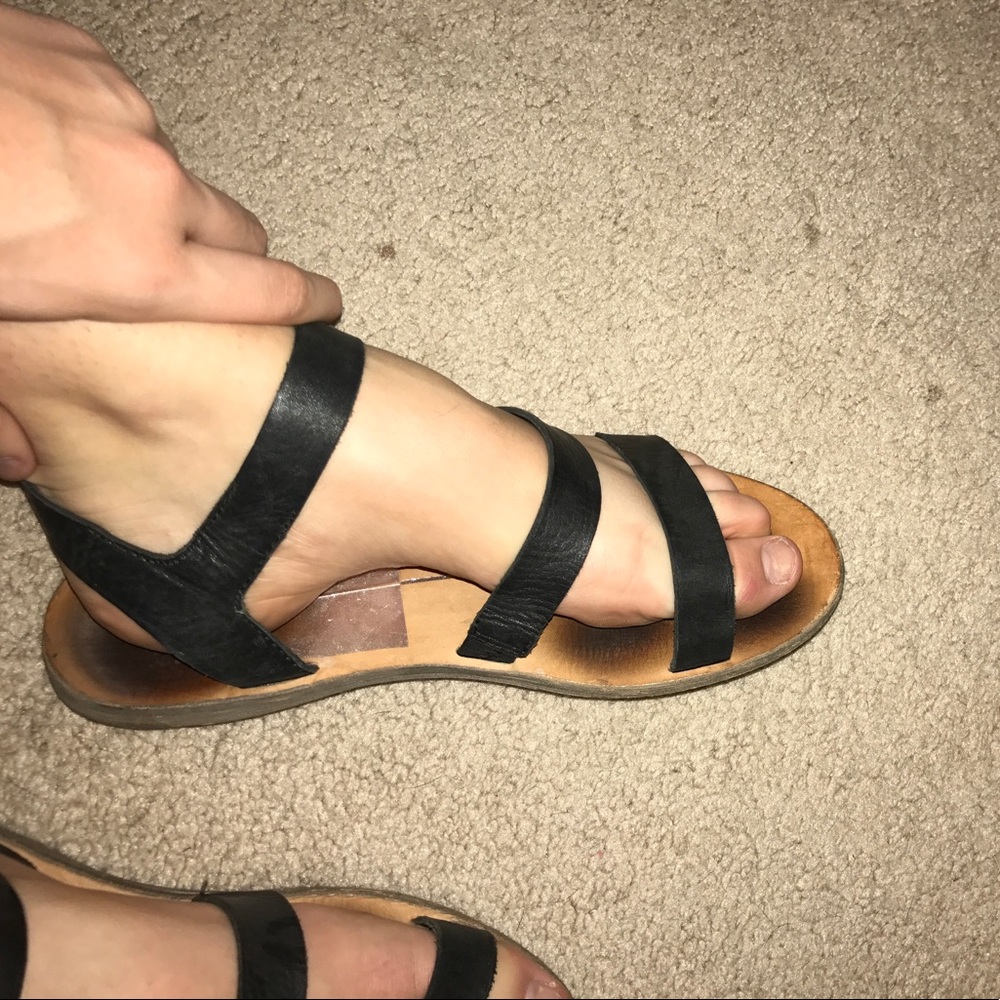 Black leather strapped sandals