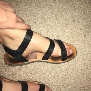 Black leather strapped sandals