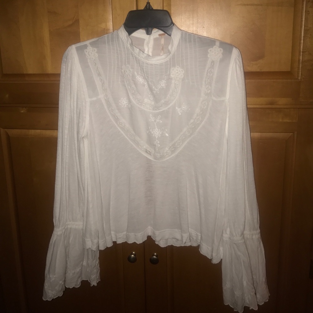 Free People bell sleeve white blouse.
