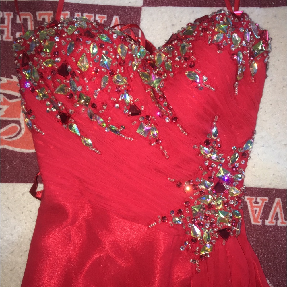 Red jeweled strapless prom dress