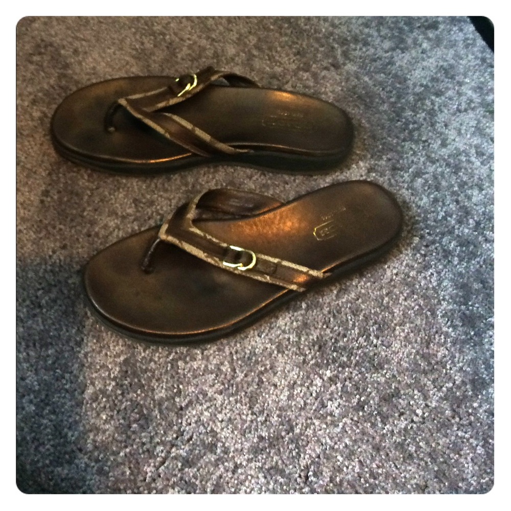 Brown coach flip flops