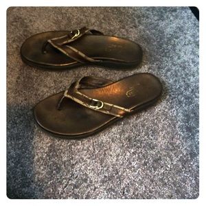 Brown coach flip flops
