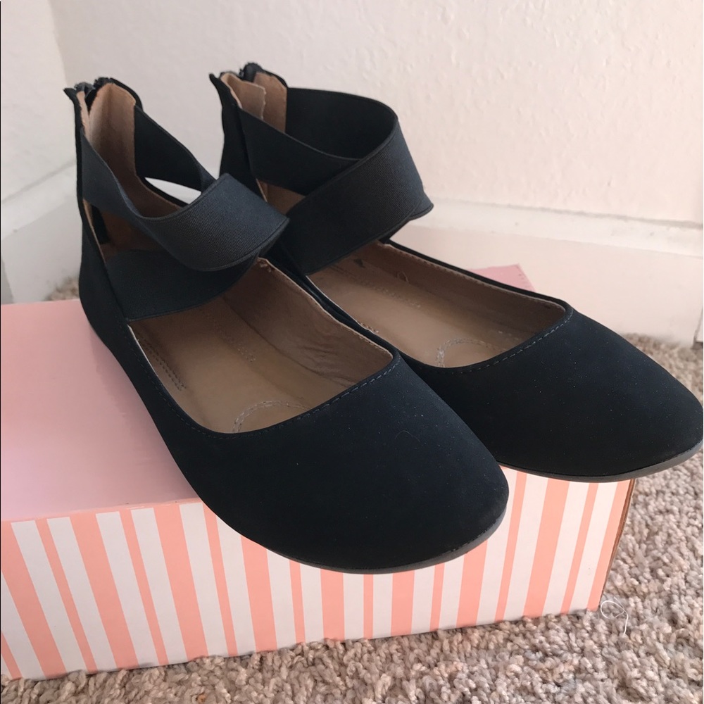 Black ballet flats with ankle wrap detail